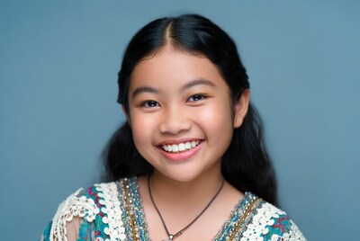 Smiling Asian girl in floral dress