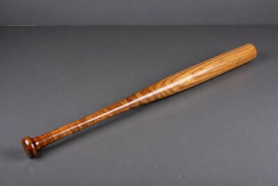 Wooden Baseball Bat on Gray Background
