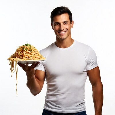 Man holding plate of spaghetti
