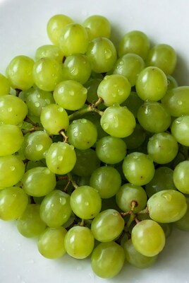 Fresh green grapes with water droplets
