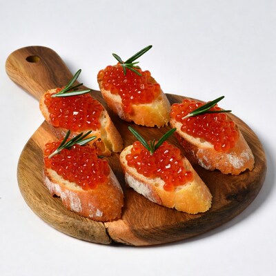 Salmon Roe Bruschetta on Wooden Board