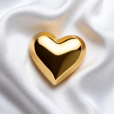 Golden heart on white silk
