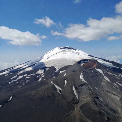 Snow-Capped Volcano with Crater