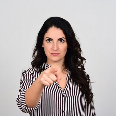 Woman pointing finger at viewer
