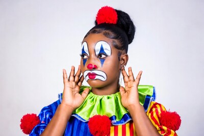 Black girl in clown costume