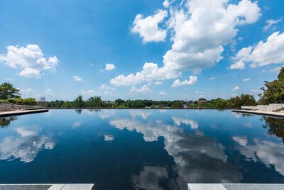 Infinity Pool Reflecting Blue Sky Clouds