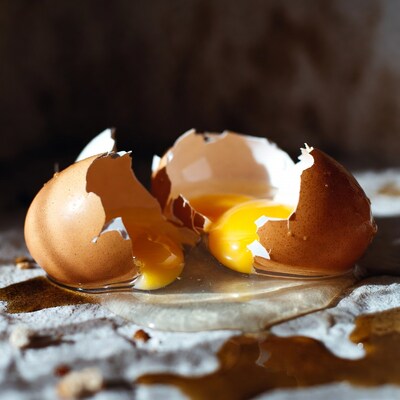 Broken egg with runny yolk
