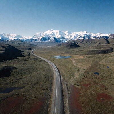 Winding road through snowy mountains