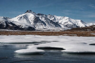 Snowy Mountains with Frozen Lake