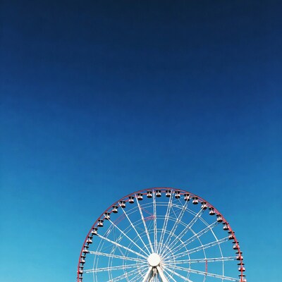 Ferris wheel against blue sky