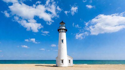 White lighthouse on beach