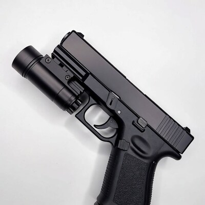 Black Glock Pistol with Tactical Flashlight