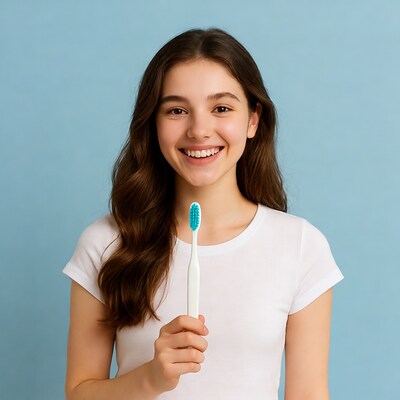 Girl smiling with toothbrush