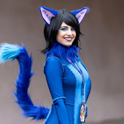 Woman in blue cat ears cosplay