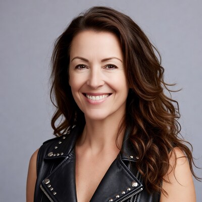Smiling woman in studded leather vest