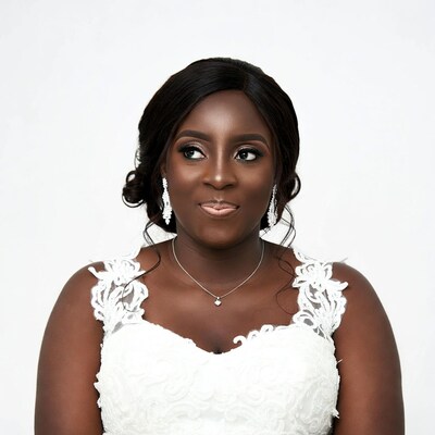 African woman in white lace wedding dress