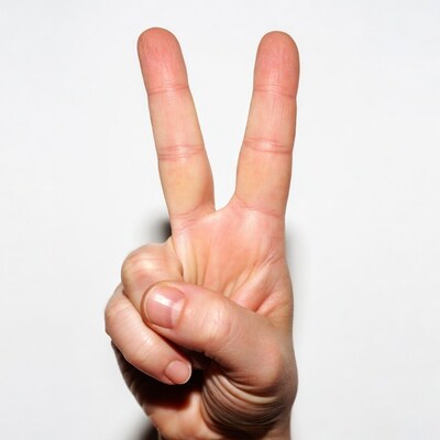 Hand making peace sign