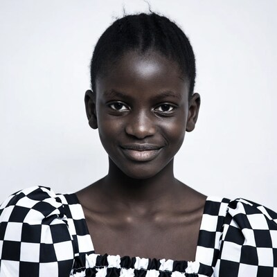 African girl in checkered puff sleeve top