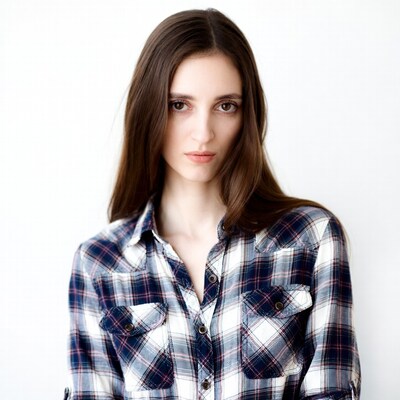 Woman in plaid shirt on white background