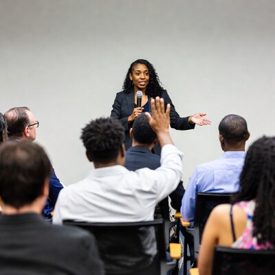 African-American woman speaking at conference