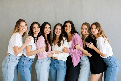 Group of young women hugging together