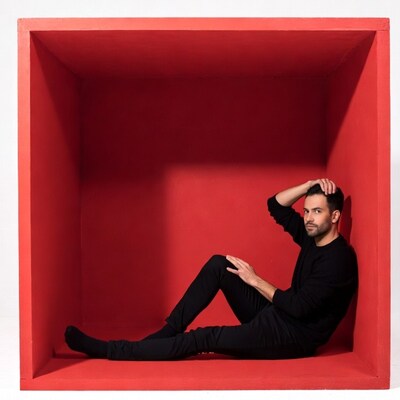 Man sitting in red box