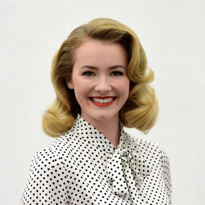 Smiling woman in polka dot blouse
