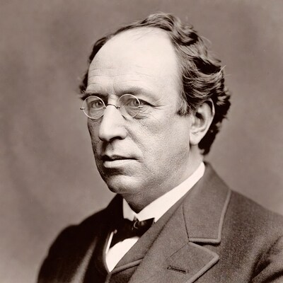 Elderly man in suit and glasses