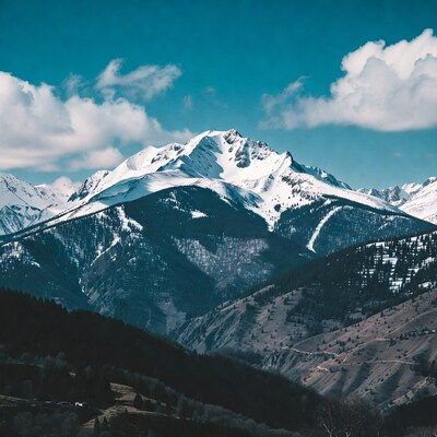 Snowy Mountain Peak with Blue Sky