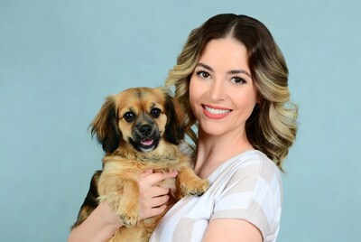 Woman holding cute puppy