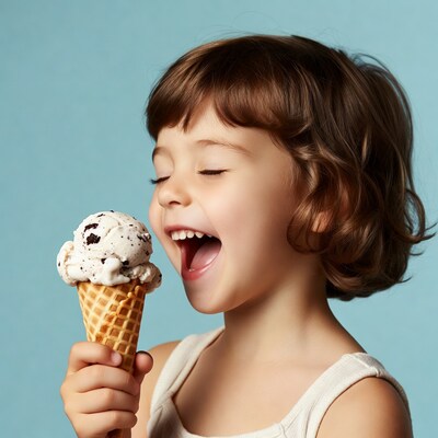 Girl eating cookies and cream ice cream cone