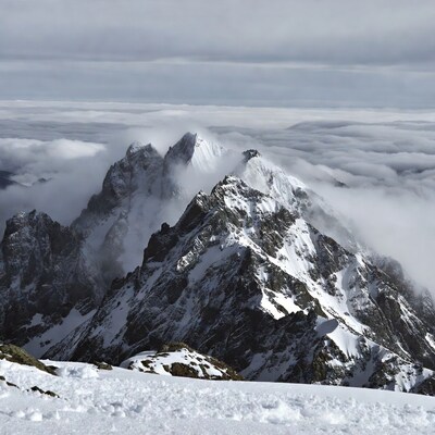 Snowy Mountains Above Clouds