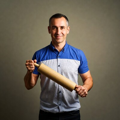 Man holding wooden rolling pin