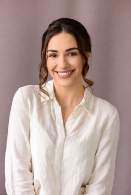 Smiling woman in white shirt