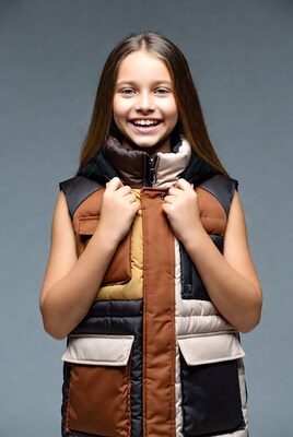 Girl smiling in colorful puffer vest