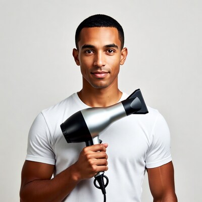 Black man holding hair dryer