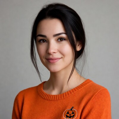 Smiling woman in orange Halloween sweater
