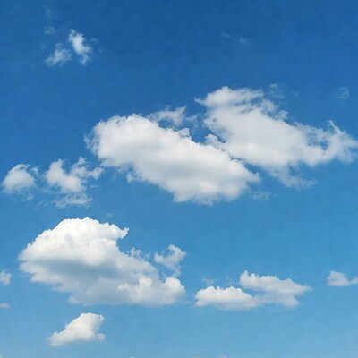 Fluffy white clouds in blue sky