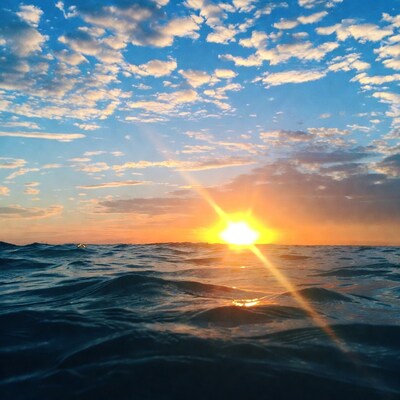 Sunset over ocean waves