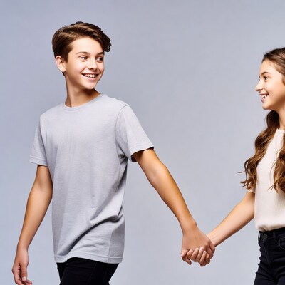 Teen boy and girl holding hands