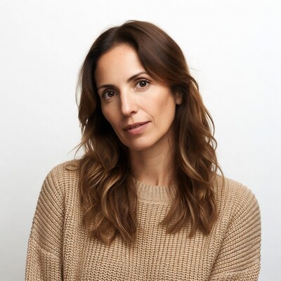 Woman in beige sweater smiling