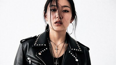 Asian woman in studded leather jacket