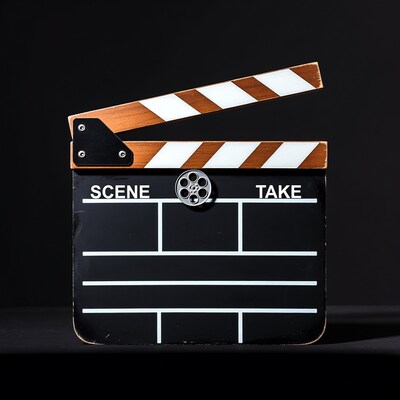 Movie clapperboard on black background