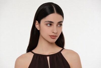 Beautiful woman in brown dress looking aside