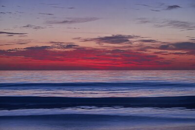 Vibrant Sunset Over Ocean Waves