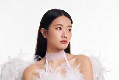 Asian woman in white feather dress
