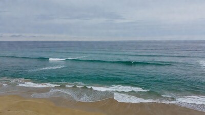 Ocean Waves Crashing on Sandy Beach