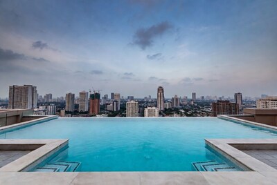 Infinity Pool Over City Skyline