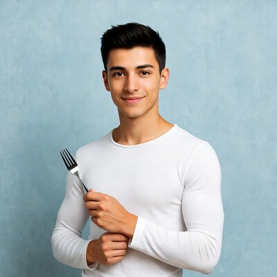 Young man holding fork