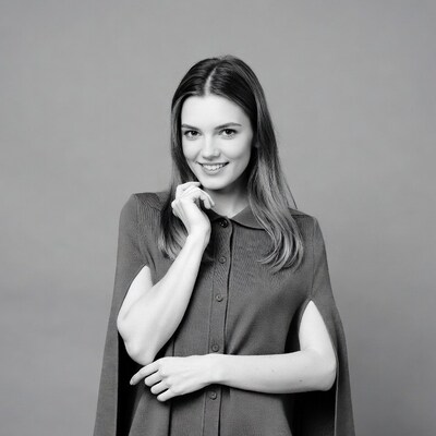 Smiling woman in cape jacket